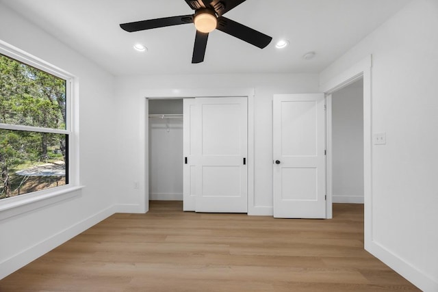 240 Hanauma Dr, Bastrop, TX 78602 - unfurnished bedroom featuring baseboards, recessed lighting, a closet, light wood-style flooring, and ceiling fan