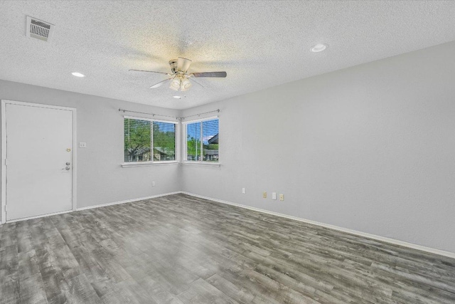 317 W William Cannon Dr B, Unit A, Austin, TX 78745 - empty room featuring wood finished floors, ceiling fan, a textured ceiling, and recessed lighting