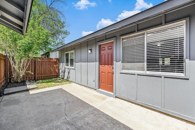317 W William Cannon Dr B, Unit A, Austin, TX 78745 - entrance to property featuring a patio area and board and batten siding
