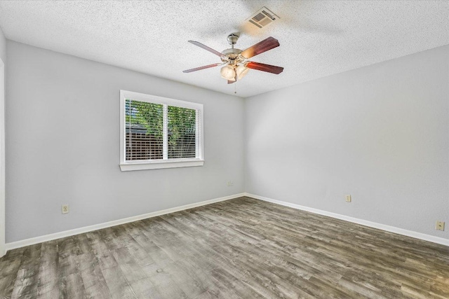 317 W William Cannon Dr B, Unit A, Austin, TX 78745 - unfurnished room featuring wood finished floors, a ceiling fan, a textured ceiling, and baseboards