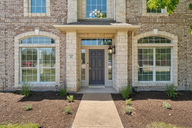 6611 Yaupon Dr, Austin, TX 78759 - property entrance with stone siding and brick siding