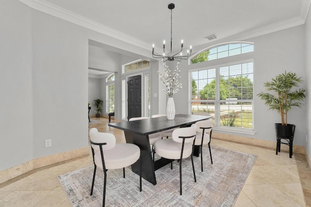 6611 Yaupon Dr, Austin, TX 78759 - dining area with a chandelier, crown molding, and tile patterned flooring