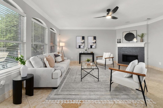 6611 Yaupon Dr, Austin, TX 78759 - tiled living area with crown molding, a ceiling fan, and a tile fireplace