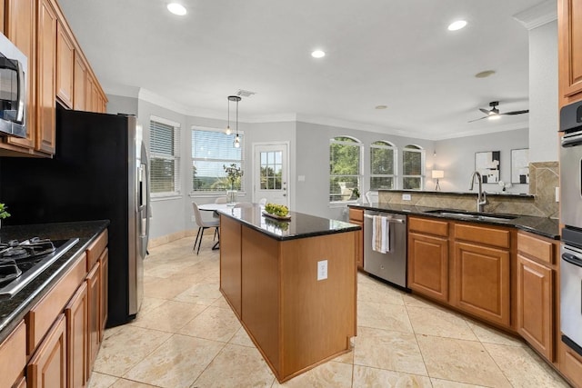 6611 Yaupon Dr, Austin, TX 78759 - kitchen with stainless steel appliances, recessed lighting, plenty of natural light, ceiling fan, and a center island