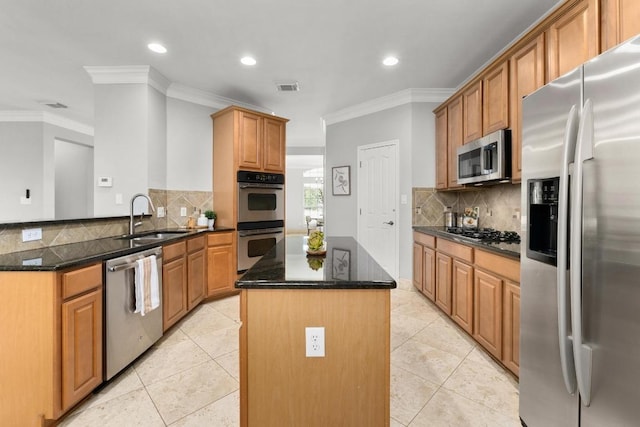 6611 Yaupon Dr, Austin, TX 78759 - kitchen with appliances with stainless steel finishes, a center island, ornamental molding, a peninsula, and recessed lighting