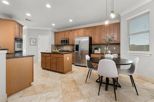 6611 Yaupon Dr, Austin, TX 78759 - kitchen with stainless steel appliances, crown molding, decorative backsplash, dark countertops, and a kitchen island