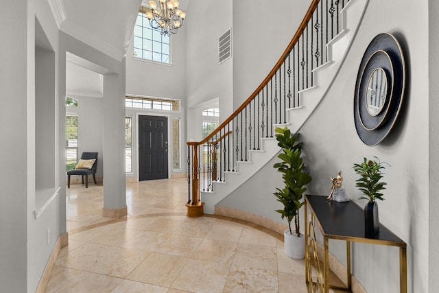6611 Yaupon Dr, Austin, TX 78759 - entrance foyer with a chandelier, stairway, and a high ceiling