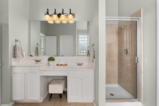 6611 Yaupon Dr, Austin, TX 78759 - bathroom with a stall shower, double vanity, and tile patterned flooring