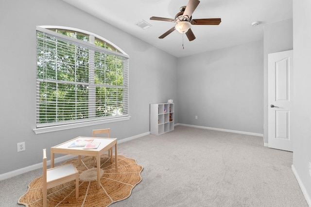 6611 Yaupon Dr, Austin, TX 78759 - living area with carpet floors, ceiling fan, and vaulted ceiling