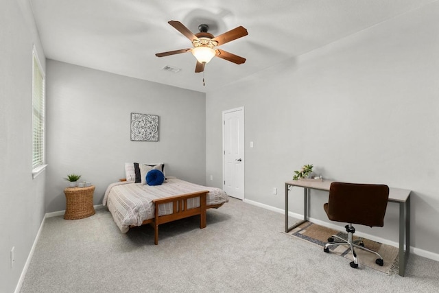 6611 Yaupon Dr, Austin, TX 78759 - bedroom with carpet, an office area, and a ceiling fan