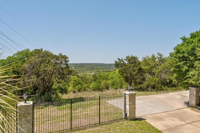 6611 Yaupon Dr, Austin, TX 78759 - view of yard with a wooded view