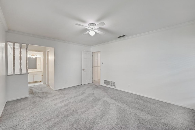 1700 Barton Hills Dr, Austin, TX 78704 - empty room featuring a ceiling fan, ornamental molding, and carpet flooring