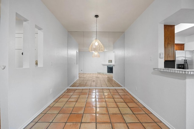 8200 Neely Dr Unit 103, Austin, TX 78759 - unfurnished dining area with baseboards and light tile patterned flooring