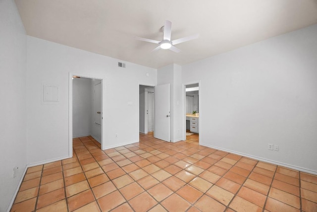 8200 Neely Dr Unit 103, Austin, TX 78759 - unfurnished bedroom with a walk in closet, a closet, ceiling fan, baseboards, and light tile patterned flooring