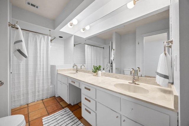 8200 Neely Dr Unit 103, Austin, TX 78759 - bathroom featuring toilet, double vanity, shower / bath combination with curtain, and tile patterned flooring