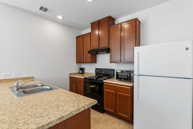 kitchen featuring light countertops, black appliances, under cabinet range hood, visible vents, and a sink