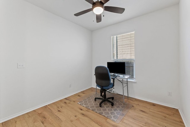 home office with wood finished floors, baseboards, and a ceiling fan