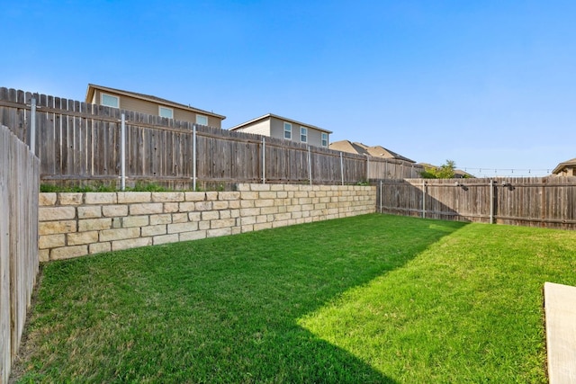 view of yard featuring a fenced backyard