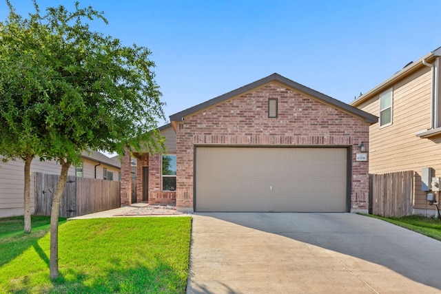 view of front of house featuring an attached garage, driveway, fence, and brick siding