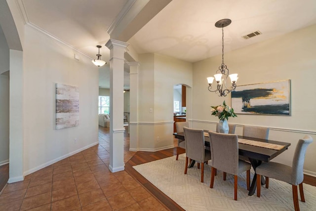 3610 Turkey Path Bnd, Cedar Park, TX 78613 - tiled dining area featuring arched walkways, a chandelier, ornamental molding, and ornate columns