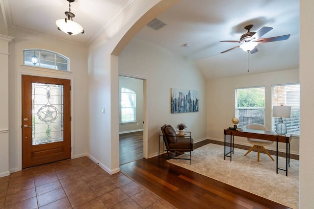 3610 Turkey Path Bnd, Cedar Park, TX 78613 - foyer entrance with healthy amount of natural light, arched walkways, wood finished floors, crown molding, and a ceiling fan
