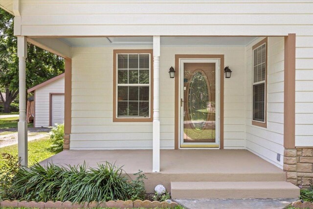 406 Garwood St, Smithville, TX 78957 - view of exterior entry featuring a porch