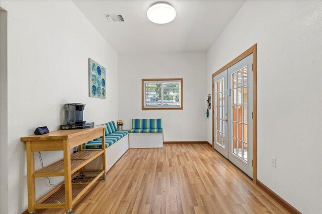 406 Garwood St, Smithville, TX 78957 - home office featuring light wood finished floors, baseboards, and french doors