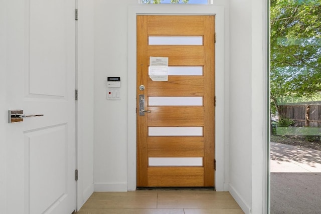 11907 Pollyanna Ave, Austin, TX 78753 - doorway to outside with light tile patterned floors and baseboards