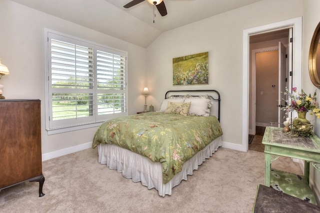 bedroom featuring baseboards, a ceiling fan, light carpet, and lofted ceiling