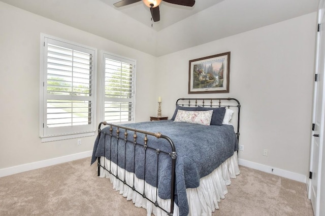 bedroom with carpet floors, baseboards, and a ceiling fan