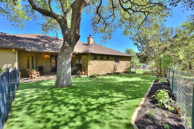 view of yard with a fenced backyard and a patio