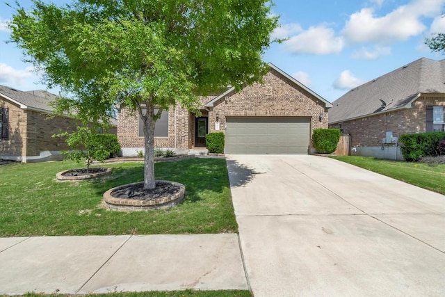 3613 Esperanza Dr, Round Rock, TX 78665 - view of front of property featuring brick siding, a garage, a front lawn, and concrete driveway