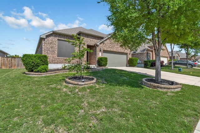 3613 Esperanza Dr, Round Rock, TX 78665 - view of front of house with brick siding, driveway, and an attached garage