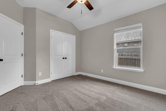 3613 Esperanza Dr, Round Rock, TX 78665 - unfurnished bedroom with carpet, baseboards, lofted ceiling, a closet, and a ceiling fan