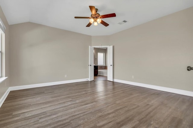 3613 Esperanza Dr, Round Rock, TX 78665 - unfurnished room featuring a ceiling fan, dark wood finished floors, baseboards, and vaulted ceiling
