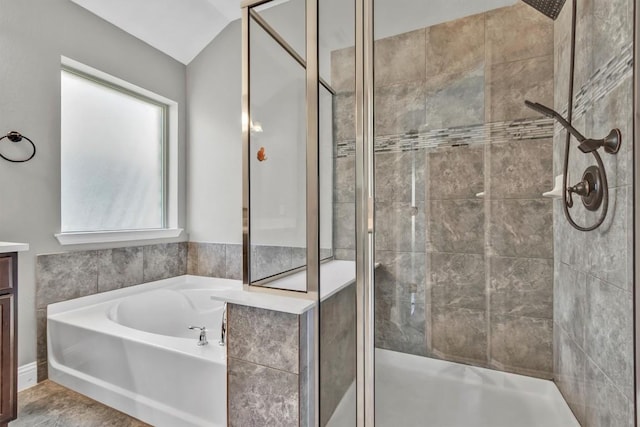 3613 Esperanza Dr, Round Rock, TX 78665 - bathroom with a stall shower, a bath, vaulted ceiling, and vanity