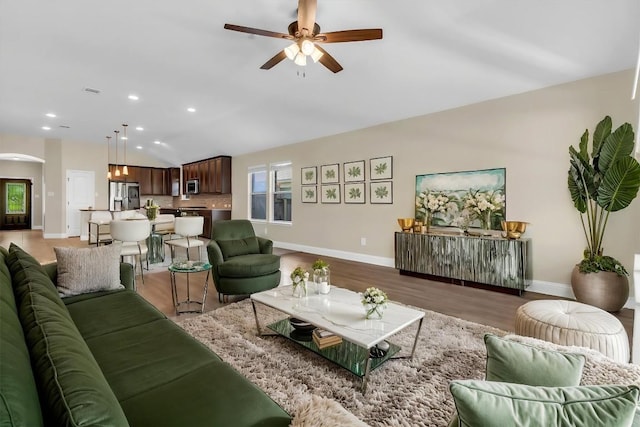 3613 Esperanza Dr, Round Rock, TX 78665 - living area with arched walkways, a ceiling fan, light wood-type flooring, baseboards, and recessed lighting