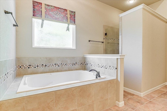 full bathroom featuring tile patterned flooring, a tile shower, and a garden tub