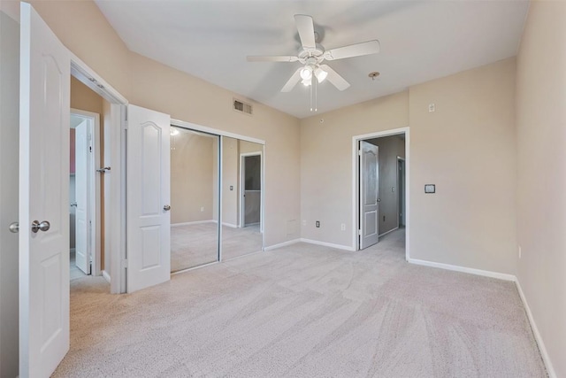11203 Ranch Road 2222 1105, Austin, TX 78730 - unfurnished bedroom featuring light colored carpet, a closet, and ceiling fan