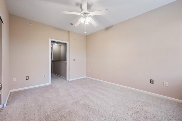 11203 Ranch Road 2222 1105, Austin, TX 78730 - unfurnished bedroom featuring light colored carpet, a walk in closet, ceiling fan, and a closet