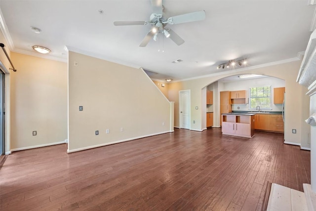11203 Ranch Road 2222 1105, Austin, TX 78730 - unfurnished living room with a ceiling fan, crown molding, dark wood-type flooring, and arched walkways