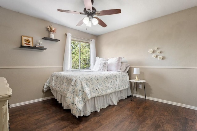 bedroom with wood finished floors, ceiling fan, and baseboards