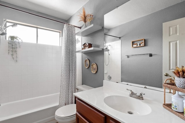 full bathroom with toilet, shower / tub combo, a textured wall, and vanity
