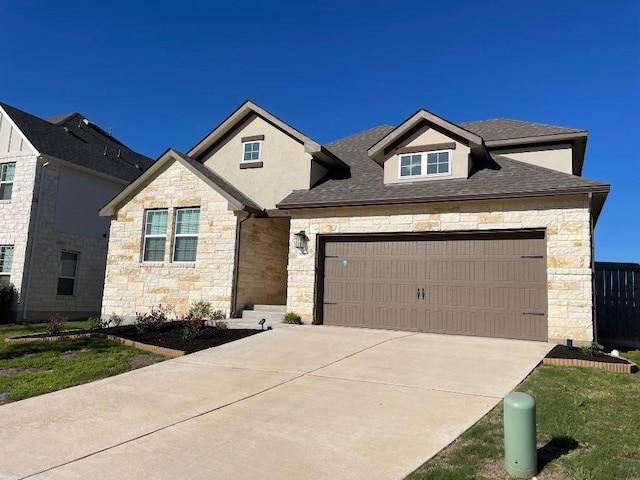 504 Pinnacle View Dr, Georgetown, TX 78628 - view of front of house featuring stone siding, an attached garage, driveway, and a shingled roof