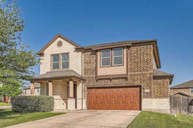 1161 Verna Brooks Way, Kyle, TX 78640 - traditional-style house with stone siding, an attached garage, driveway, and a shingled roof