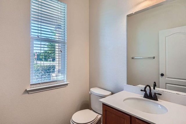 1161 Verna Brooks Way, Kyle, TX 78640 - half bath featuring toilet, vanity, and a textured wall