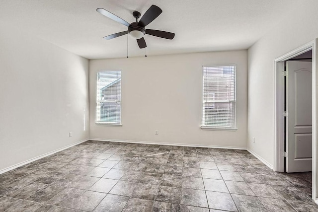 1161 Verna Brooks Way, Kyle, TX 78640 - spare room with a ceiling fan, tile patterned flooring, and baseboards