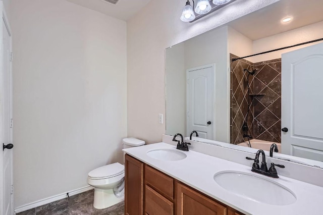 1161 Verna Brooks Way, Kyle, TX 78640 - bathroom with double vanity, toilet, shower / bathtub combination, and baseboards
