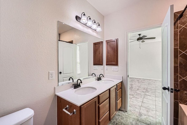 1161 Verna Brooks Way, Kyle, TX 78640 - bathroom featuring double vanity, toilet, tile patterned flooring, and a ceiling fan