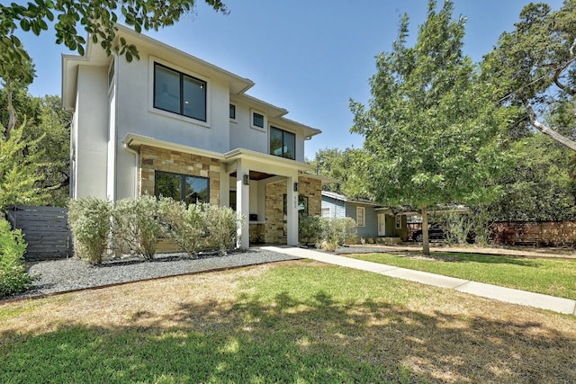903 W Gibson St, Austin, TX 78704 - contemporary home with stone siding, a front lawn, and stucco siding